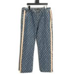 Louis Vuitton washed blue jeans with all-over print and side straps